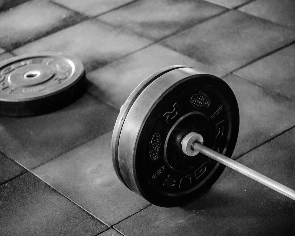 Athletic equipment on a wooden floor in a gym