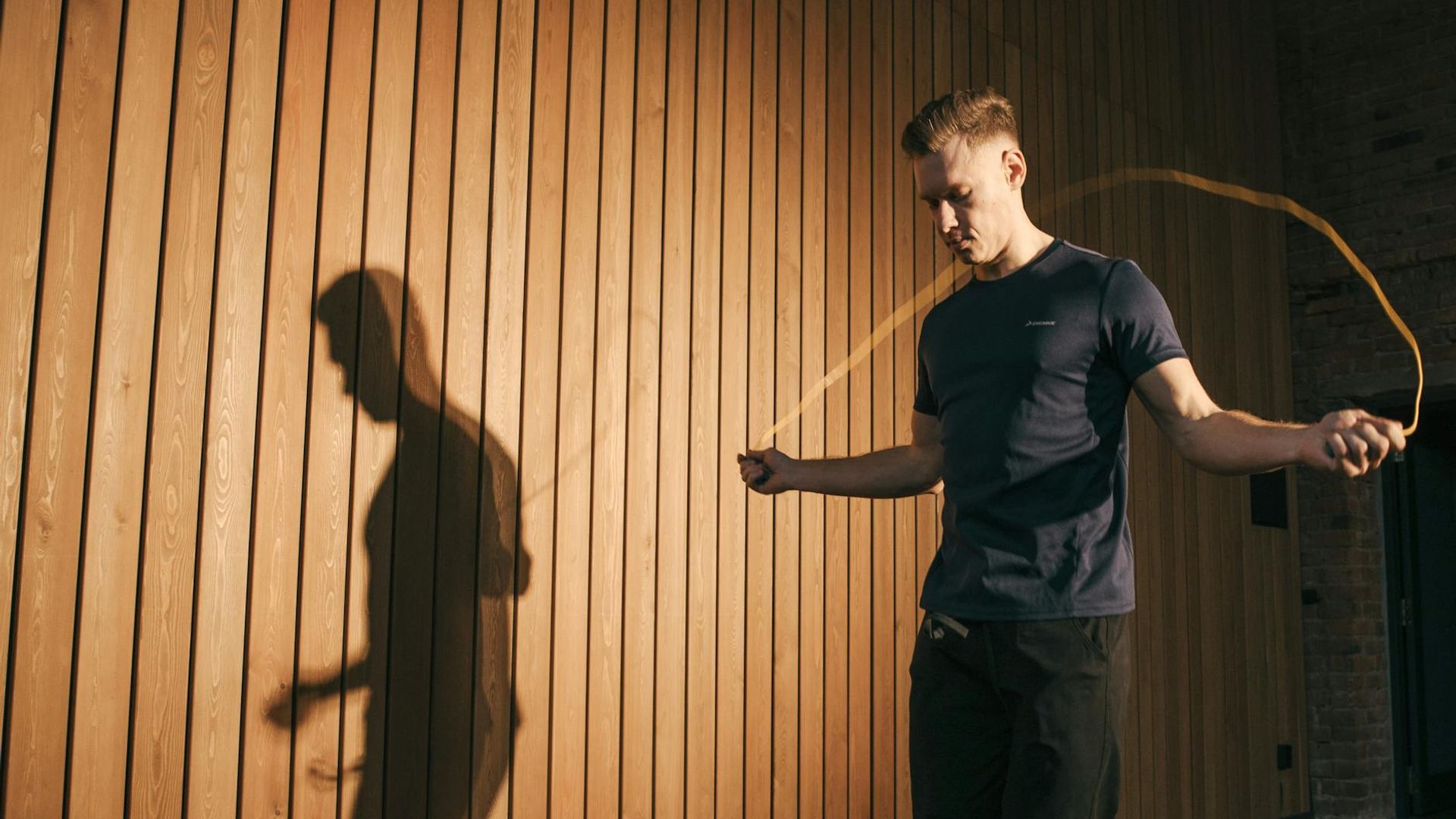 Person doing light cardio movements in a sunlit room